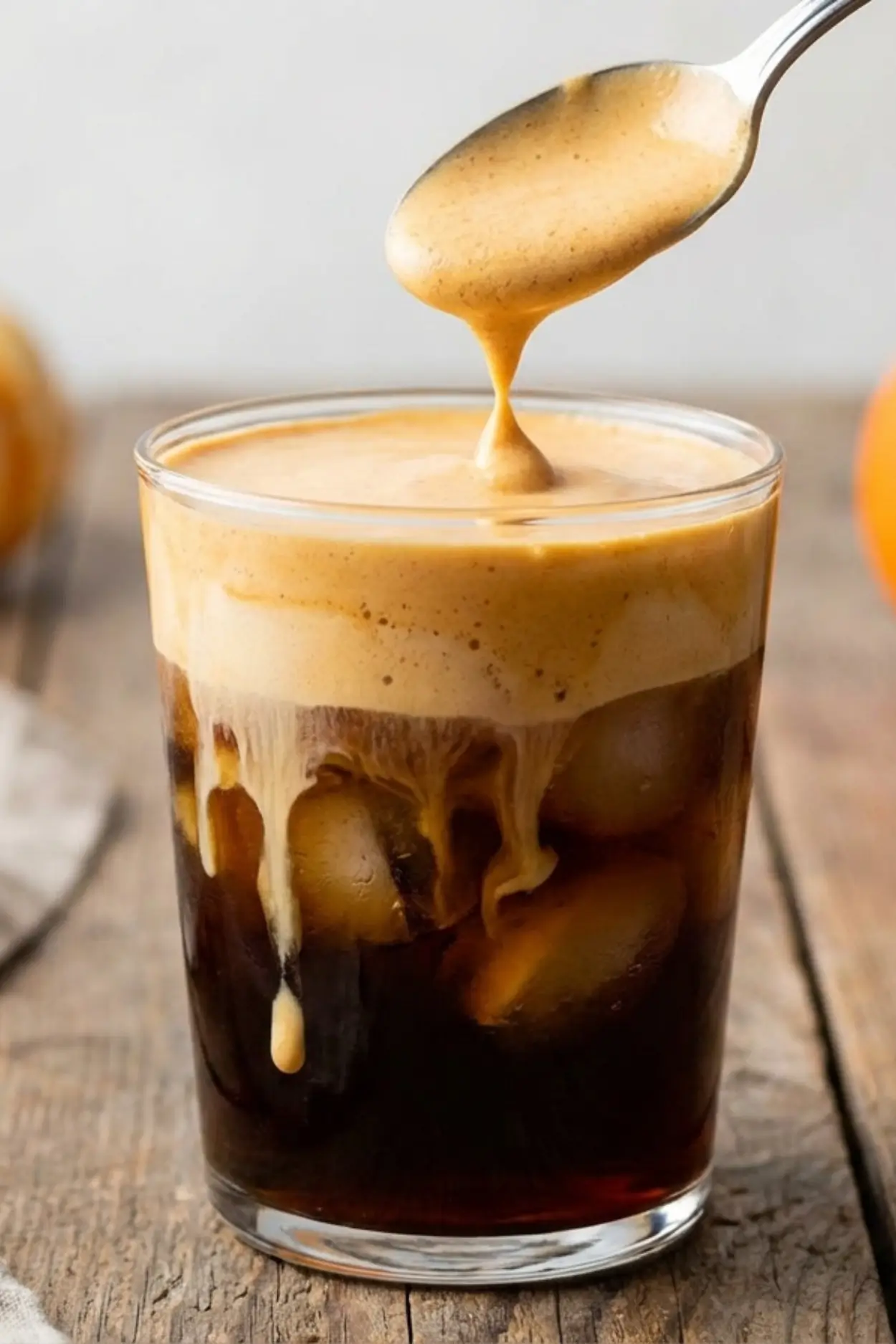 Pumpkin foam poured over cold brew